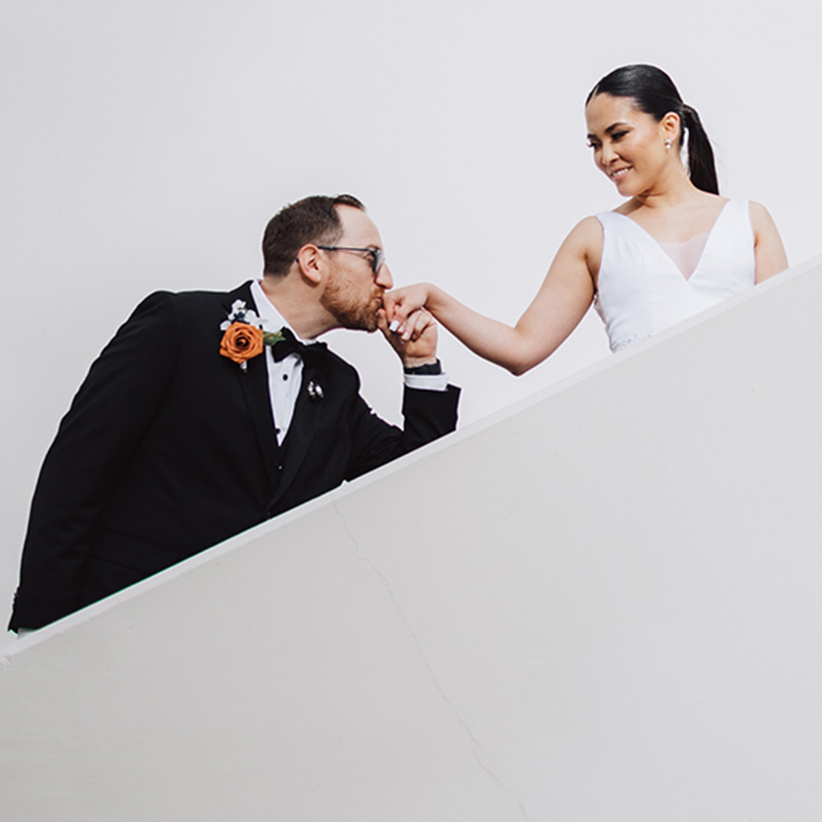 Joe and Jess on the steps in love.